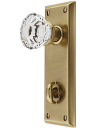 Quincy Thumb-Turn Door Set with Astoria Crystal Glass Knobs in Antique Brass.